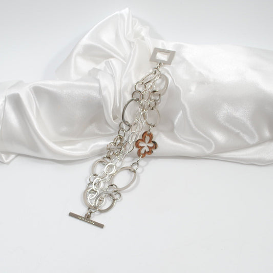 armband i silver med egendesingde delar som blommor cirklar design by brandeby