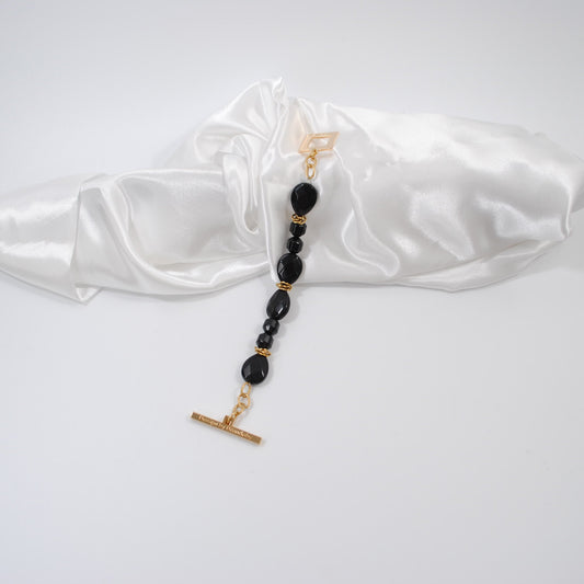 armband i svart och guld design by brandeby