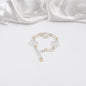 armband i guld och silver med blommor design by brandeby
