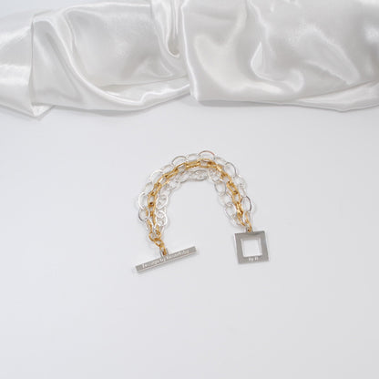 designat armband i två färger guld silver kedjor design by brandeby