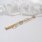 elegant armband i silver och guld med blomma och cirklar med guld kedja design by brandeby