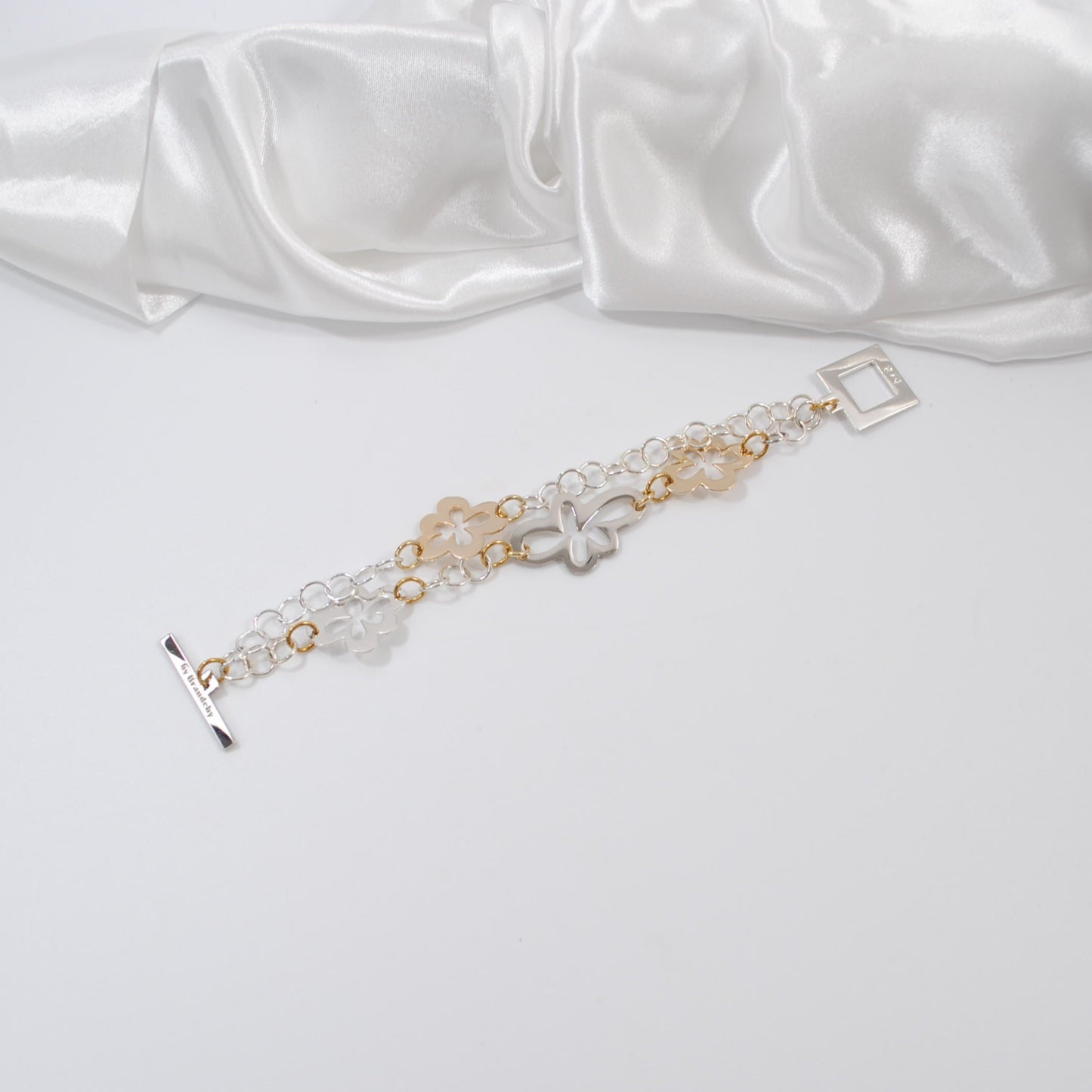 exklusivt armband med blommor i silver och guld design by brandeby