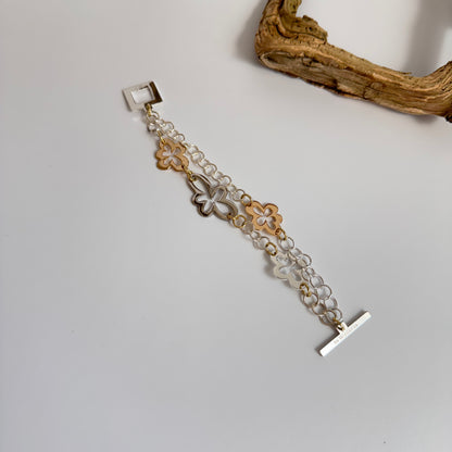 handgjort armband i guld och silver blommor äkta svenskt hantverk